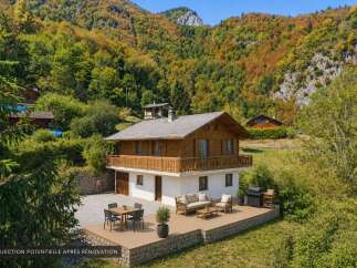 Discover this charming wooden chalet nestled in a picturesque mountain setting, perfect for a serene getaway.