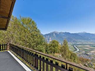 Experience breathtaking panoramic views from this stunning property, featuring a spacious balcony perfect for enjoying the majestic mountain landscape.