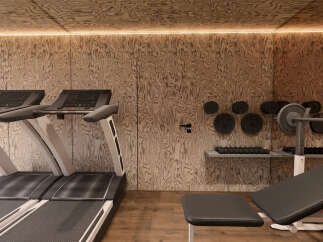 Elevate your fitness routine in this modern home gym, featuring two state-of-the-art treadmills for cardio enthusiasts.