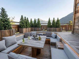 Experience breathtaking mountain views from this stunning outdoor living space, perfect for relaxation and entertaining.