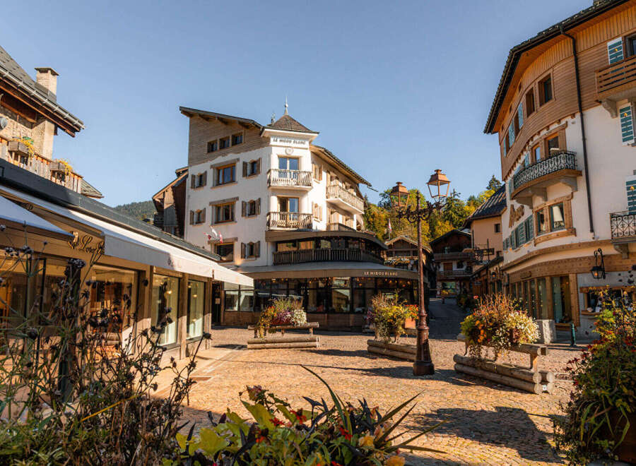 Discover this charming alpine village square, perfect for a picturesque getaway.