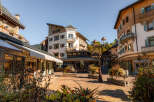 Discover this charming alpine village square, perfect for a picturesque getaway.