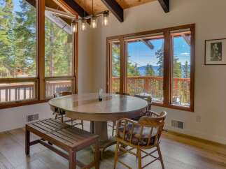 Enjoy breathtaking lake and mountain views from this charming dining area, perfect for intimate gatherings or family meals.