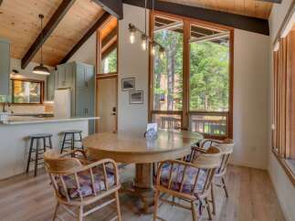 Experience the perfect blend of rustic charm and modern comfort in this inviting dining area.