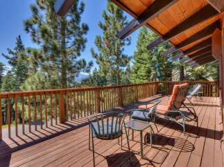 Enjoy breathtaking mountain views from this expansive wooden deck, perfect for outdoor entertaining or quiet relaxation.