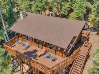 Experience the ultimate mountain retreat with this stunning A-frame cabin nestled amidst towering pine trees.