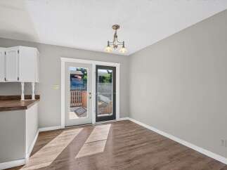 Step outside to a charming deck, perfect for enjoying your morning coffee or evening relaxation.