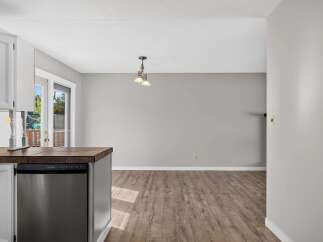Discover this charming home featuring a modern kitchen island with a built-in dishwasher, perfect for entertaining.