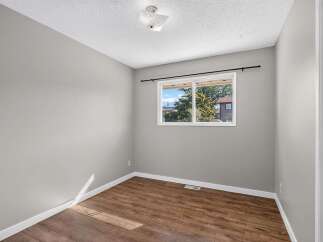 Discover this charming room featuring a large window that floods the space with natural light.
