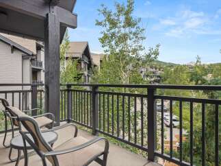 Enjoy your morning coffee or evening relaxation on this charming balcony, offering a serene view of the surrounding landscape.