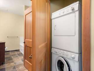 Discover convenience with this stacked washer and dryer unit, perfect for maximizing space in your home.