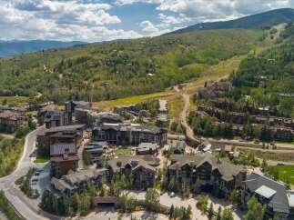 Discover luxury mountain living in this stunning aerial view of a ski resort community.