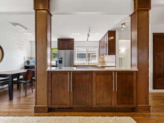 Experience the perfect blend of style and functionality in this stunning kitchen and dining area.