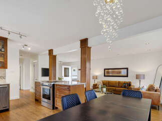 Experience modern living in this open-concept home featuring a gourmet kitchen with stainless steel appliances and ample cabinet space.