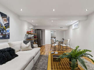 Discover this modern basement living space, perfect for relaxation and entertainment.