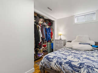 Discover this charming bedroom featuring a spacious walk-in closet, perfect for all your storage needs.