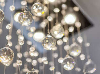 Illuminate your home with this stunning crystal chandelier, a true statement piece that adds a touch of luxury and sparkle.