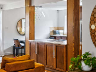 Discover an open-concept living space seamlessly connecting to a modern kitchen, perfect for entertaining.