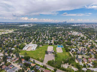Discover this charming suburban neighborhood with a school, sports fields, and tennis courts, perfect for families.