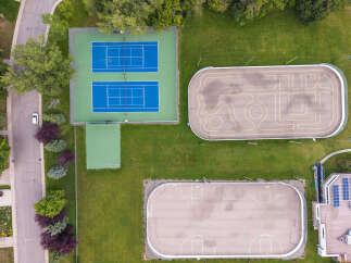 Discover a property with exceptional recreational amenities, including two pristine tennis courts and a separate practice court.