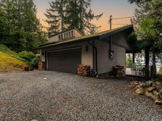 Discover this charming property featuring a spacious garage with ample storage, perfect for vehicles and outdoor equipment.