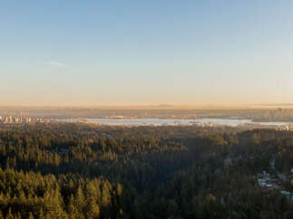 Experience breathtaking panoramic views of the city skyline and the sparkling water from this exceptional property.