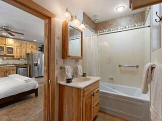 This charming studio offers a unique living space with a combined kitchen and bedroom area, perfect for efficient living.