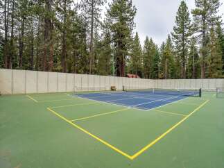 Enjoy outdoor recreation on this versatile sports court, perfect for tennis or pickleball.
