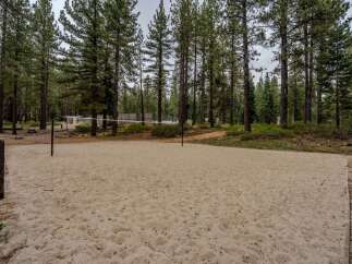 Enjoy outdoor recreation with this fantastic sand volleyball court, perfect for friendly games and summer fun.