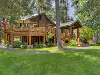 Experience rustic charm in this beautiful log cabin nestled amongst towering trees.