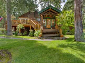 Experience rustic charm in this beautiful log cabin nestled amongst mature trees.