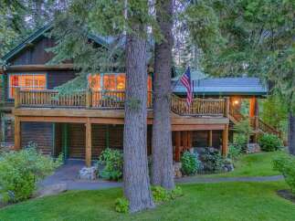 Nestled amidst tall pine trees, this charming log cabin offers a serene mountain retreat.