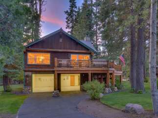 Experience rustic charm in this beautiful log cabin nestled among tall trees.