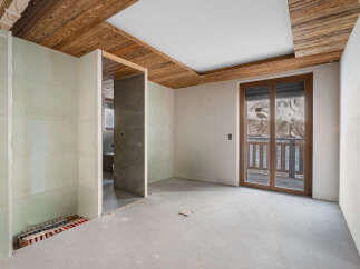 Discover this unfinished interior space, perfect for customization.