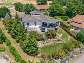 Discover this stunning property featuring a modern home with expansive outdoor living spaces, perfect for entertaining.
