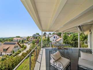 Enjoy breathtaking panoramic views from this spacious balcony, perfect for outdoor dining and relaxation.