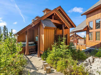 Experience ultimate relaxation in this charming mountain retreat, featuring a private hot tub perfect for unwinding after a day of adventure.