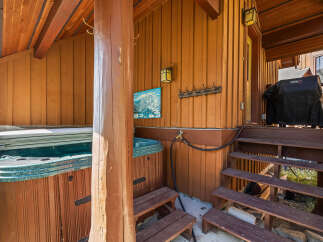 Enjoy ultimate relaxation in this property's private hot tub, perfect for unwinding after a day of adventure.