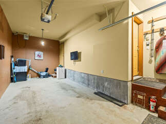 This spacious garage offers ample storage and utility for your vehicles and outdoor gear.