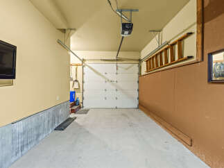 This spacious garage offers ample storage and organization solutions.