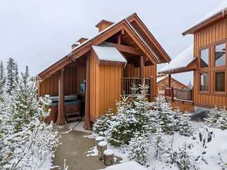 Experience ultimate relaxation in this charming mountain retreat, featuring a private hot tub perfect for soaking in the snowy scenery.