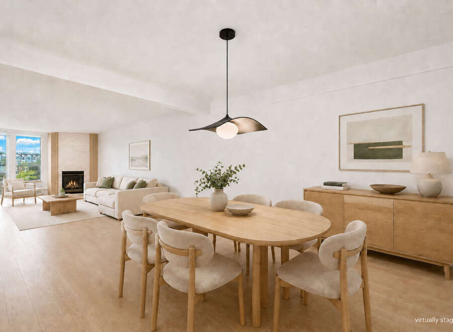 Experience modern living in this beautifully staged dining and living area.