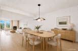 Experience modern living in this beautifully staged dining and living area.