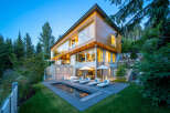 Experience luxury living in this modern architectural masterpiece nestled amidst a serene forest landscape.