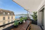 Enjoy breathtaking lake views from this stunning balcony, perfect for al fresco dining or relaxing with a morning coffee.
