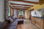 Experience cozy living in this charming room featuring a plush sectional sofa perfect for relaxation.