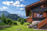 Experience alpine living in this charming wooden chalet, nestled amidst breathtaking mountain scenery.
