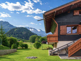 Experience alpine living in this charming wooden chalet, nestled amidst breathtaking mountain scenery.