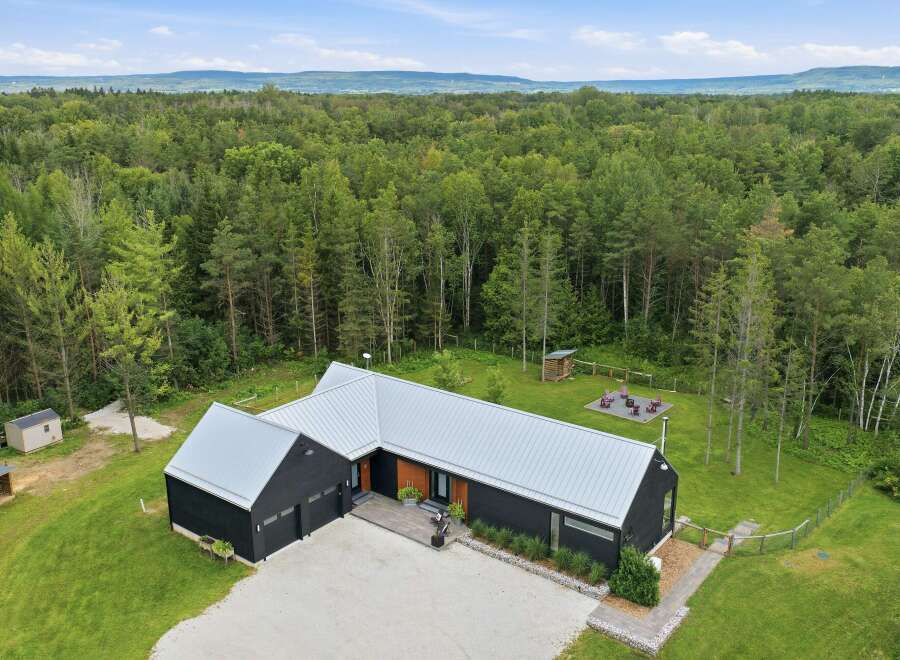 Discover this modern architectural gem nestled amidst a lush forest, offering unparalleled privacy and tranquility.