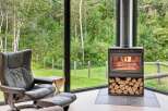 Experience cozy living in this stunning home featuring a modern wood-burning fireplace, perfect for warming up on chilly evenings.